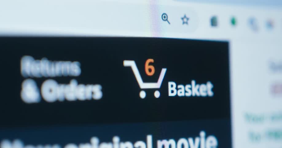 A close view of a computer screen shows a website with a shopping cart icon that has a notification number on it which changes from two to ten as the video progresses