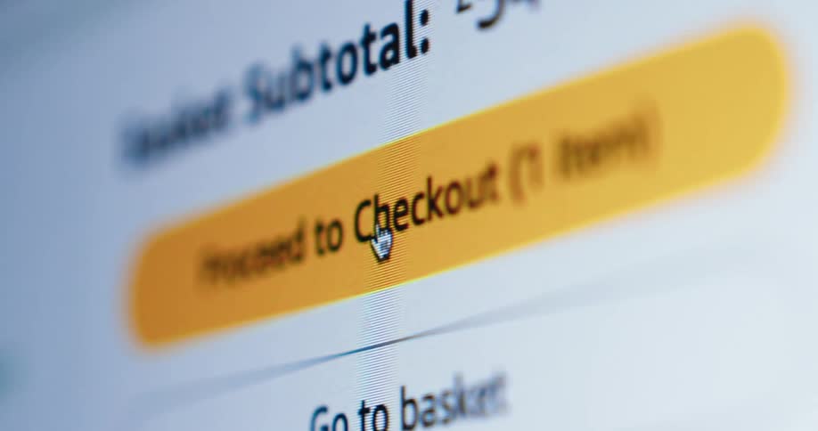 Website screen with yellow proceed to checkout button being clicked