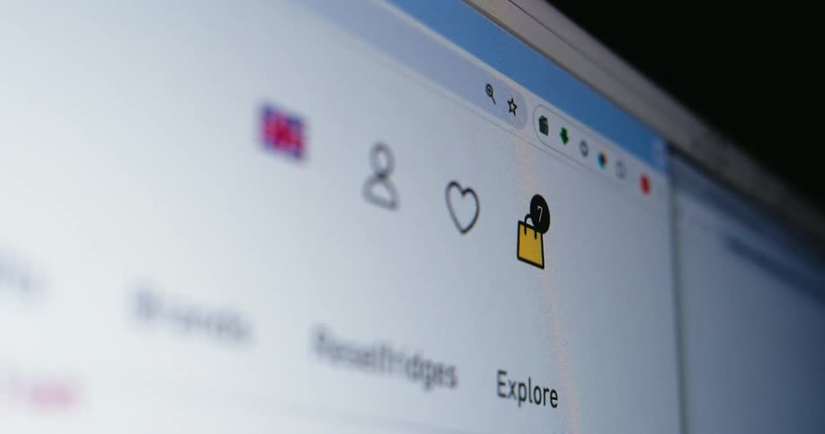 Closeup of a web browser showing shopping icons and a notification badge