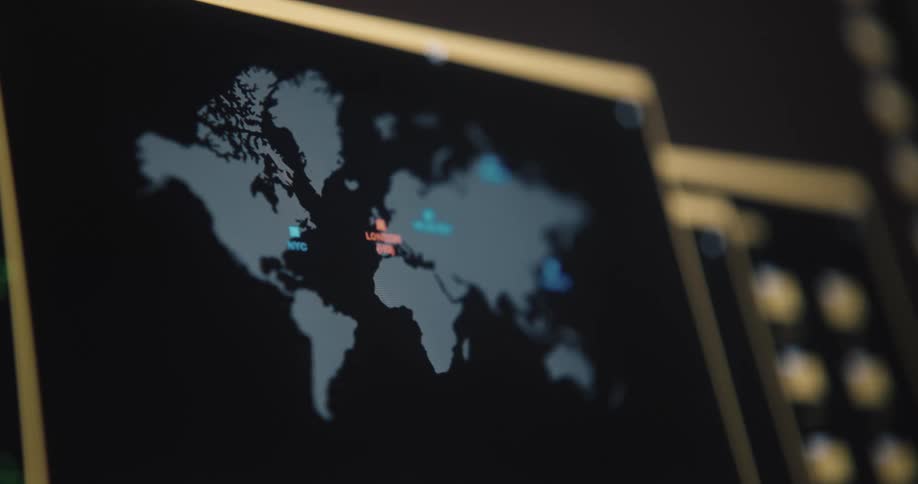 A map of the world and other graphics are displayed on a small screen