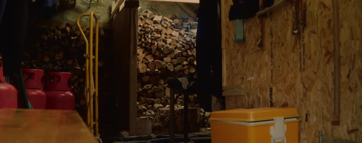 A rustic storage area with stacked supplies