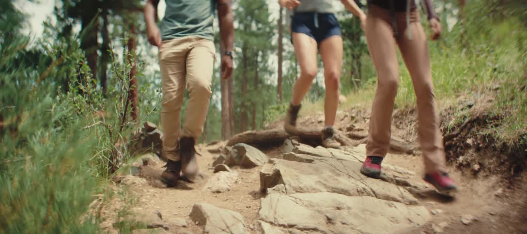 A group hike and jump over the rocks