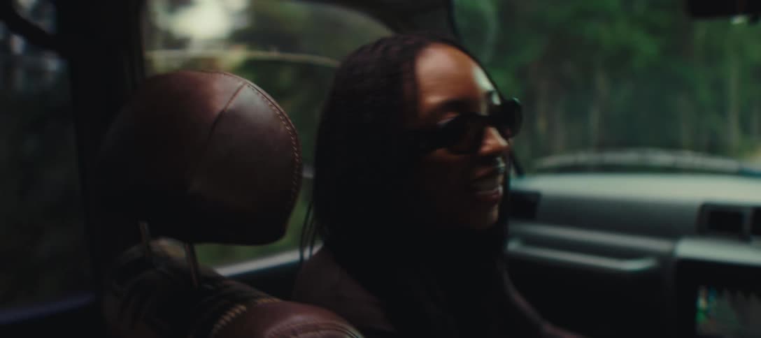 Two women talk while riding in the car