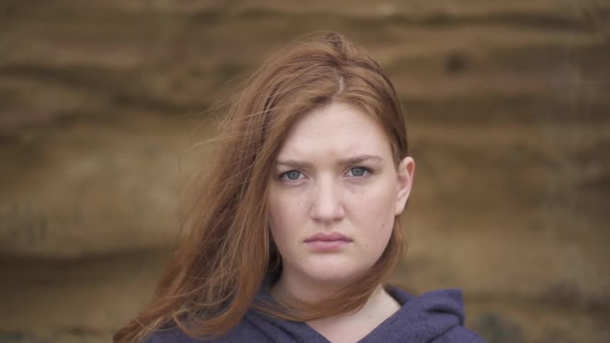 A breeze rustles a woman's hair