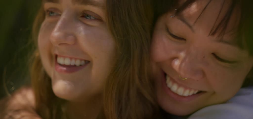 Portrait of two women embracing outdoors