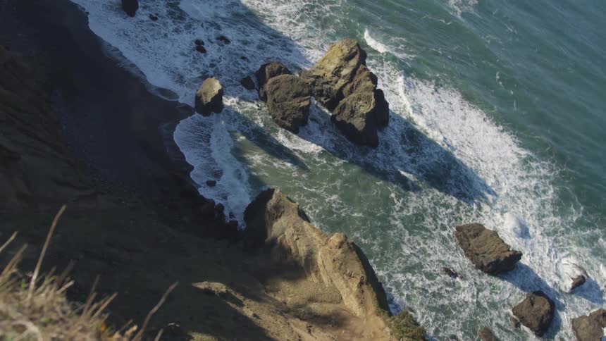 Aerial view of the rocky coastline by the sea