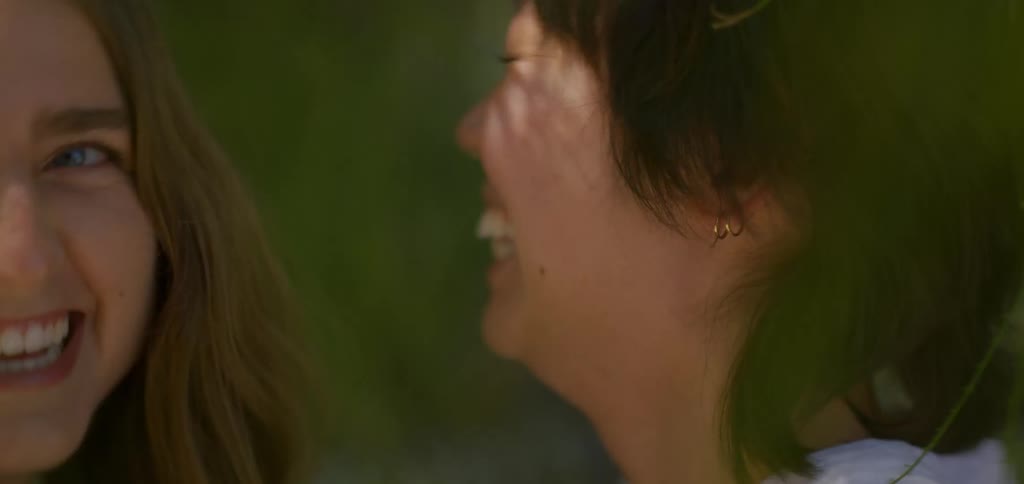 Two women outdoors laughing