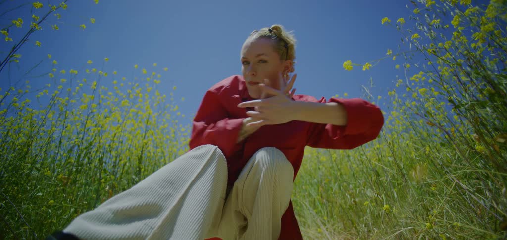 A woman dancing in a field