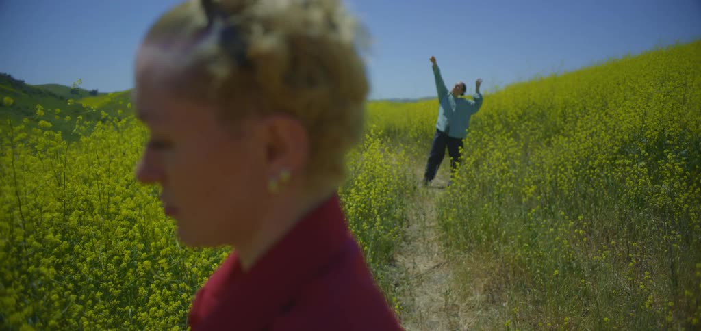 A woman moves her arms around doing tai chi