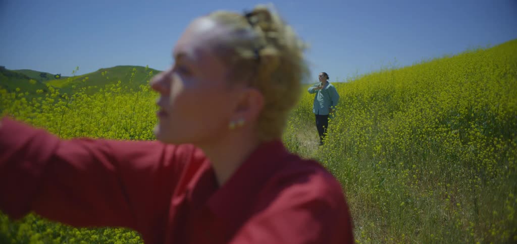 Two women do tai chi on a sunny day
