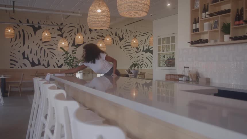 The worker is cleaning the counters