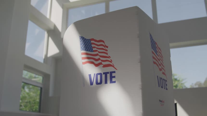 The voting booth is in the building