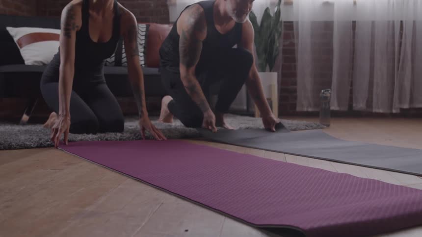 Two people in plank position during yoga practice