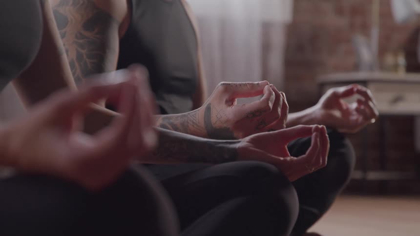 Two people are meditating together