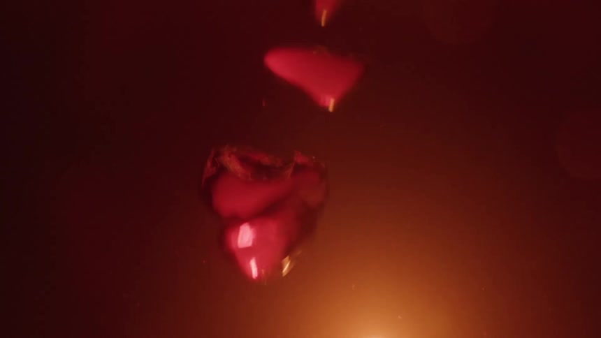 Red droplets in liquid illuminated by strong light