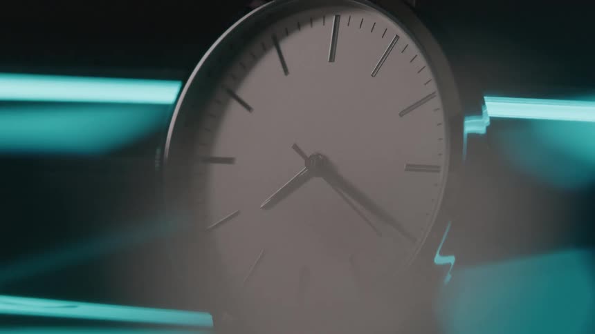 The dial on the clock spins clockwise