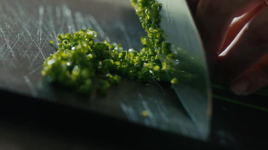 The vegetable is being chopped up