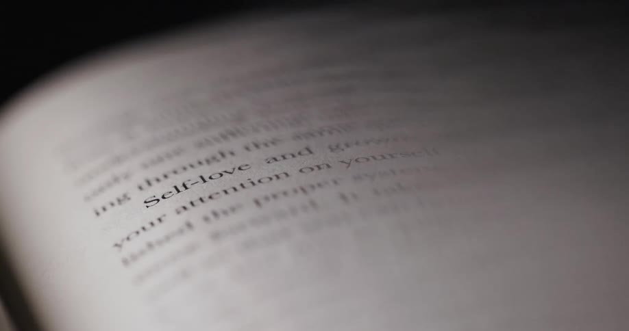 Close macro of a page with selflove in focus