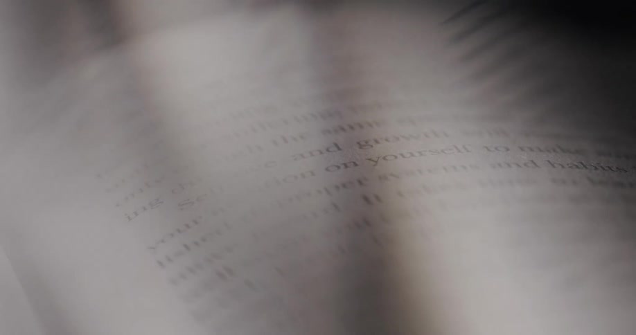 The video shows two lines of text from a book the first line is selflove and growth and the second line is your attention on yourself to make