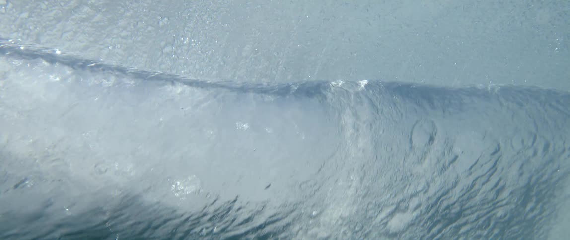 Underwater view of a rolling ocean wave
