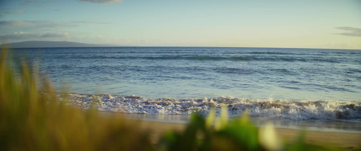 The tide hits the sand on the beach