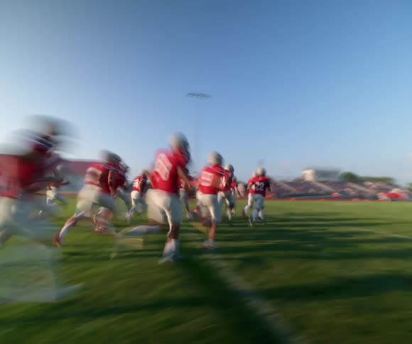 A football team runs out onto the field