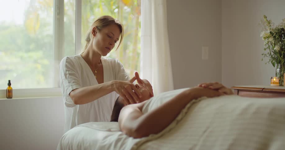 The woman is giving a massage to a patient