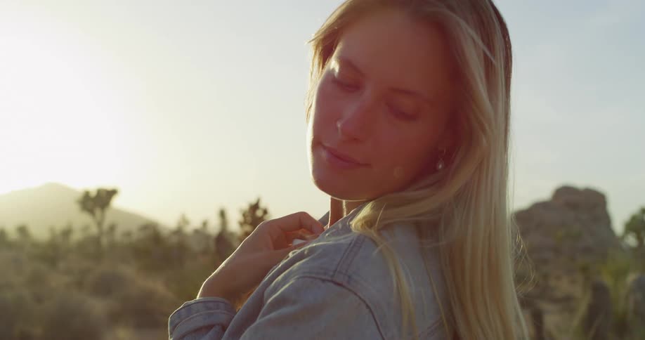 A gentle sunkissed close footage of a woman at sunset