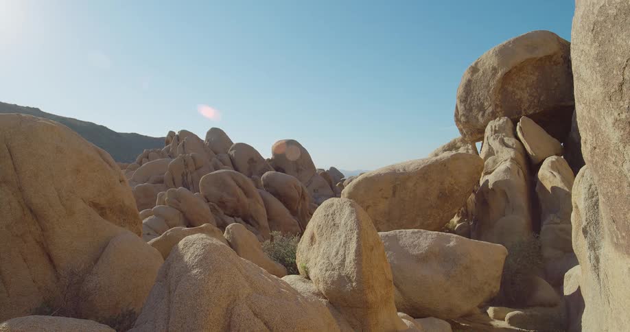 A rocky landscape with a mix of small and large rock formations at midday
