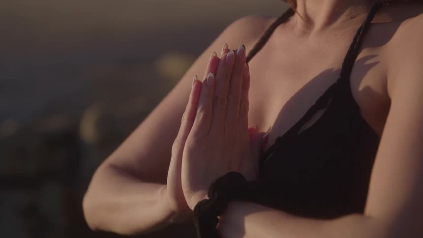 Hands joined in prayer position during yoga practice
