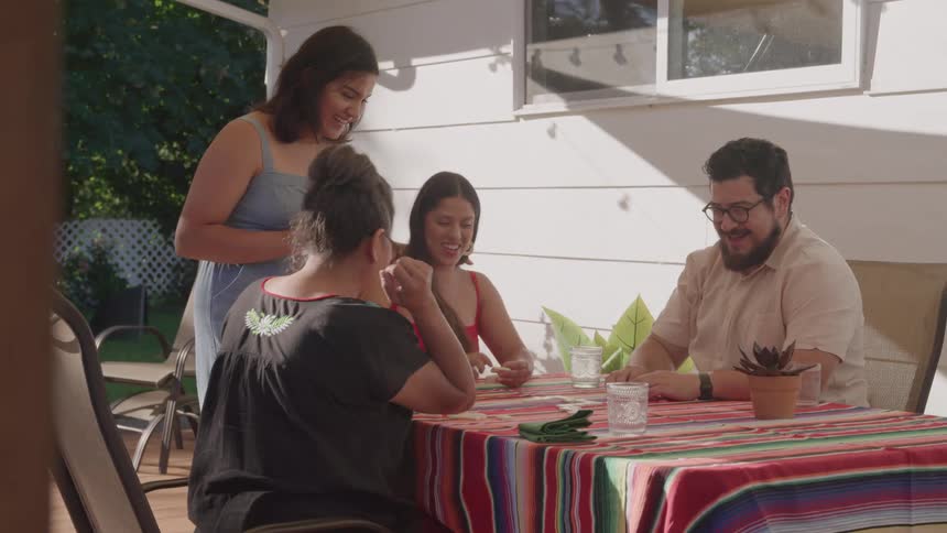 Friends having fun playing at a table