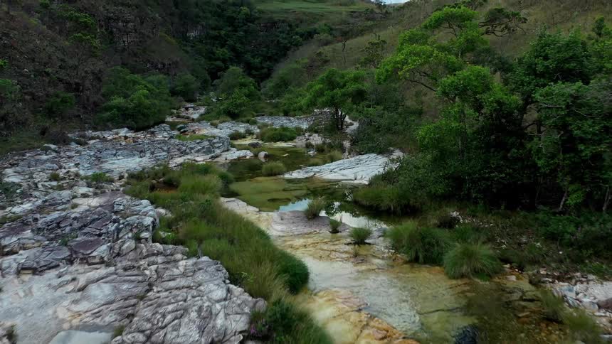 Aerial landscape of a river in a mountainous area with vegetation