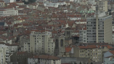 City buildings are shown in the distance