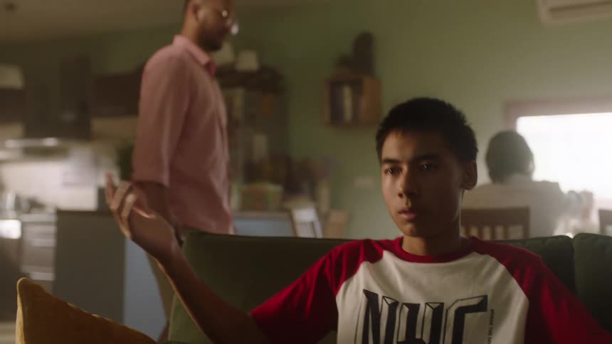 Strict father takes away a phone from his son hands at home