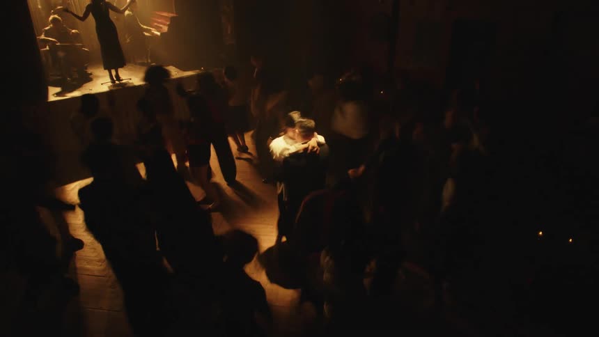 The singer entertains all the dancing customers in the club