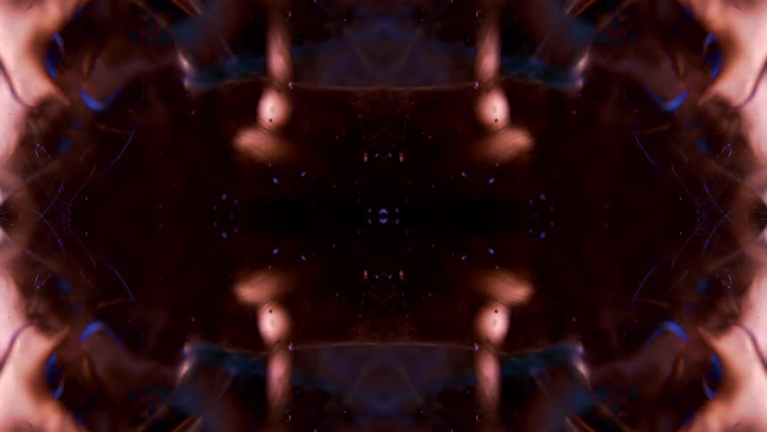 An abstract animated pattern of brown and dark blue organic shapes pulsates on a black background the shapes shift and flow at times forming a symmetrical xlike pattern