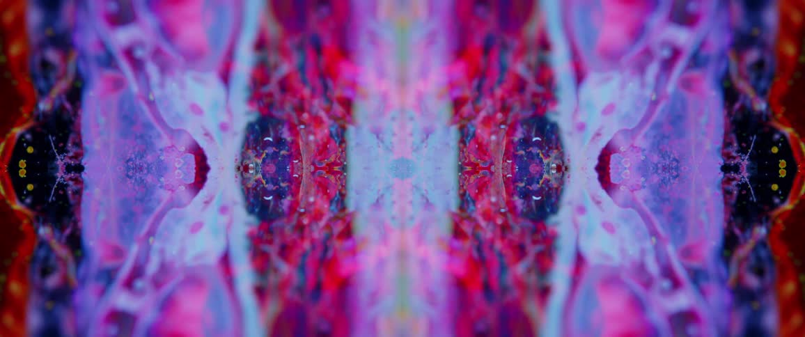A series of colorful abstract objects move around the screen