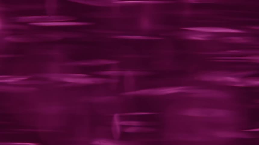 Fast spinning purple blur with streaks and shifting light