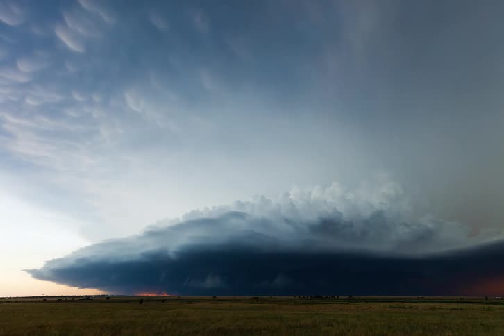 A huge storm spins and moves over the landscape