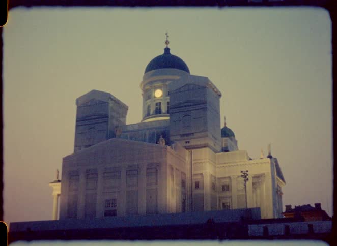 The church has a dome with a cross at the top