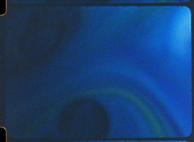 Waves and bubbles form in the blue paint