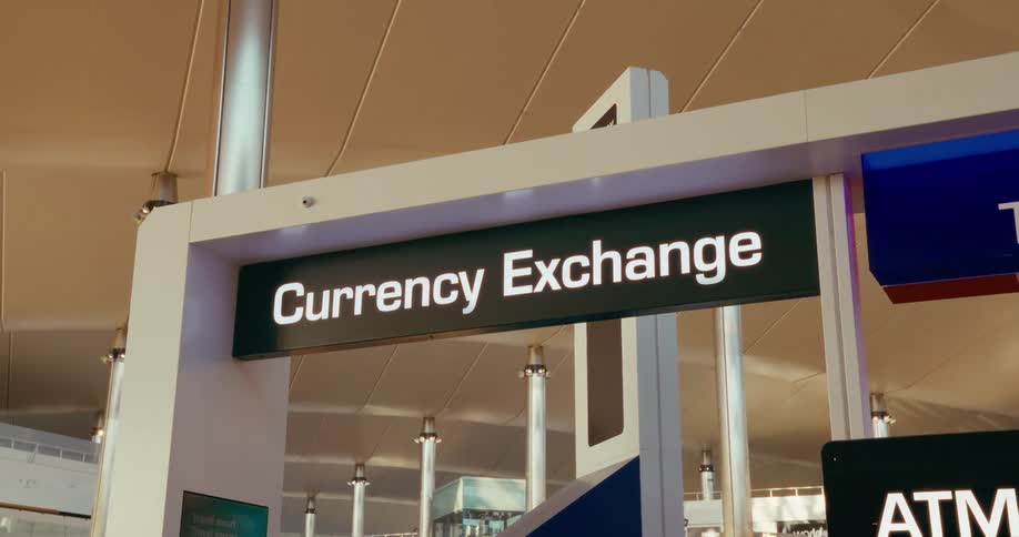 Sign identifies the location for a currency exchange in a building