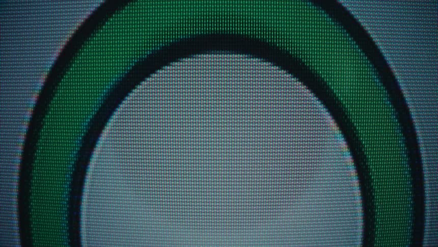 Enlarged letter o appears on a screen with visible pixels
