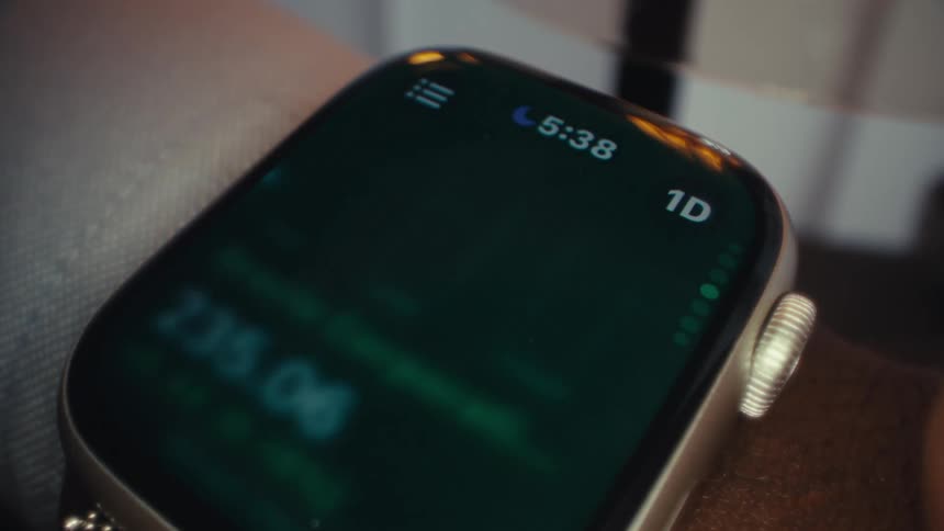 A person checking their heart rate on a smartwatch worn on their wrist
