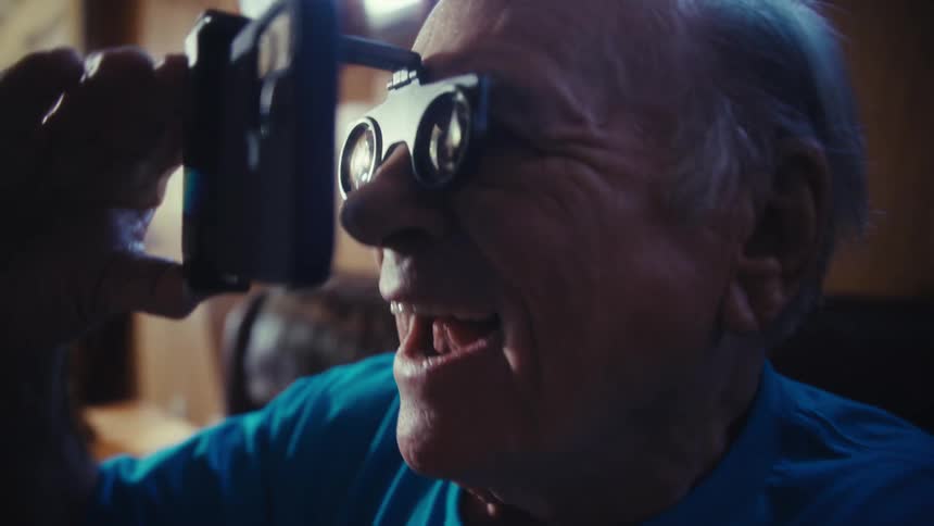 Man with contact lenses using a smartphone