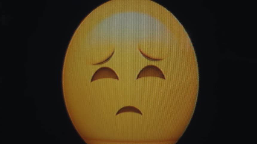 Emoji changing from sad face to happy face