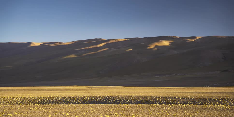 Natural landscape with sunlight reflecting off the mountains