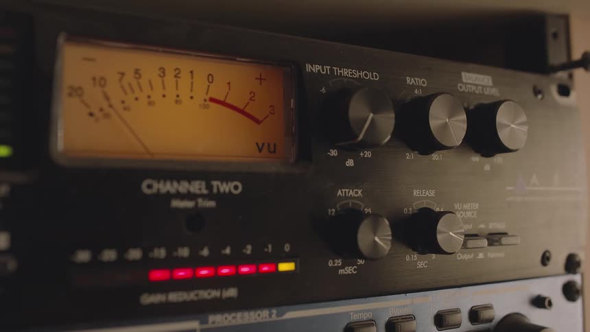 A person turns the dial of a transmission radio
