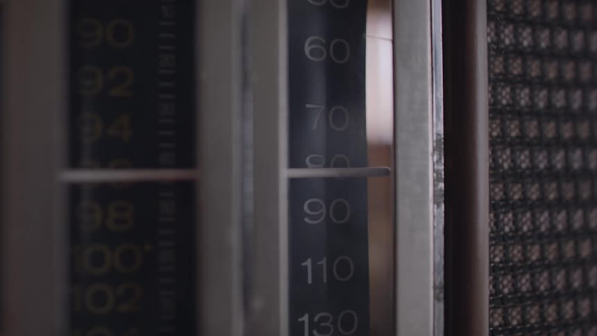 Pointer changing stations on a vintage radio