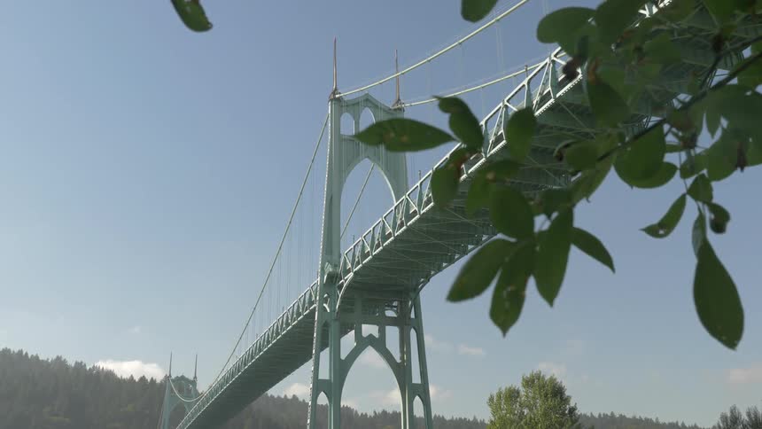 A large bridge is by the mountains